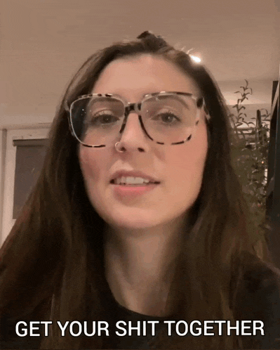 a woman wearing glasses says " get your shit together " in the corner