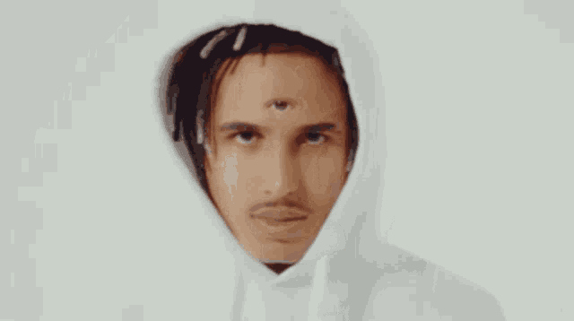 a close up of a man 's face with three eyes