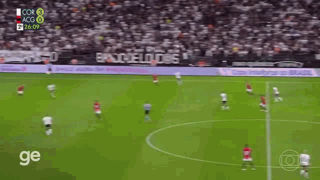 a soccer game is being played on a field with a banner that says ' simple agora ' on it