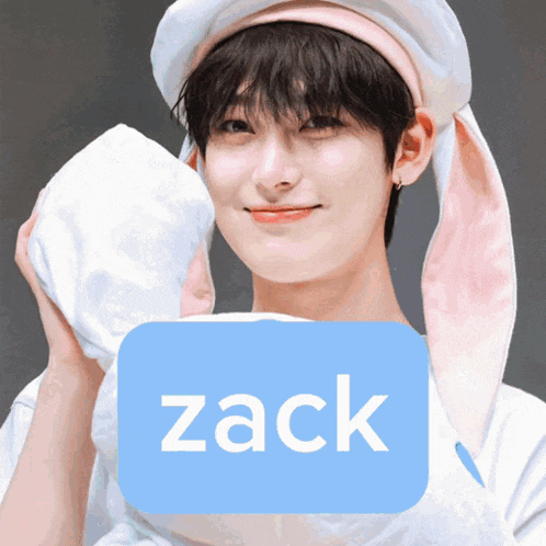 a boy wearing bunny ears and a hat with the name zack written on it