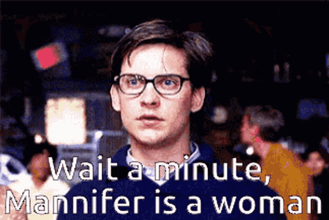 a man wearing glasses says wait a minute manner is a woman