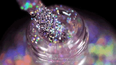 a close up of a bottle of glitter nail polish