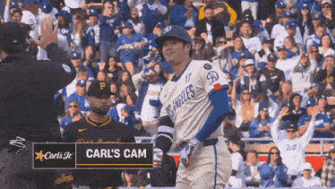 a carl 's jr. logo is on a baseball player 's jersey