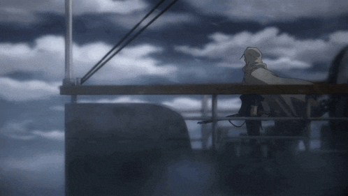 a person in a hooded cape stands on a balcony looking out over a cloudy sky