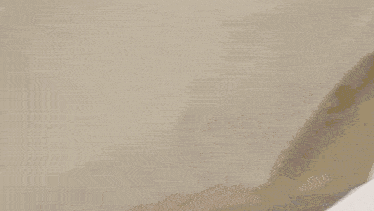 a blurred image of a staircase with a white curtain covering it
