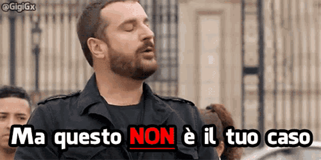 a man with a beard is singing ma questo non è il tuo caso