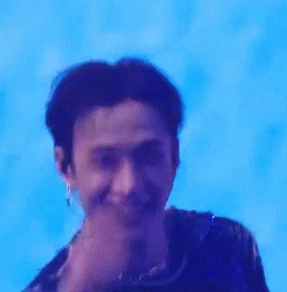 a close up of a man 's face against a blue background .