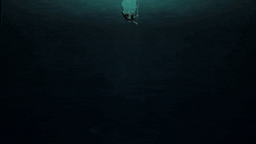 a person is swimming in the dark waters of a body of water