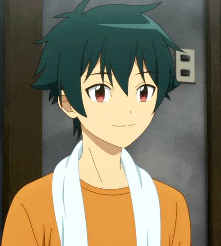a boy with a towel around his neck is smiling in front of a wall with the number 8 on it