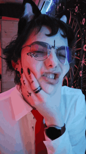 a person with glasses and a tattoo on their face that says " 666 "