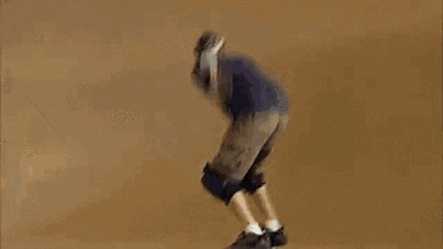 a blurry picture of a person riding a bike on a dirt track
