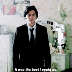 a man in a suit says it was the best i could do in front of a mirror