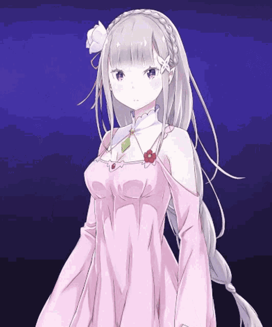 a girl in a pink dress with a flower on her hair