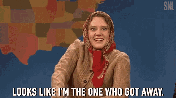 a woman wearing a scarf and a sweater says looks like i 'm the one who got away