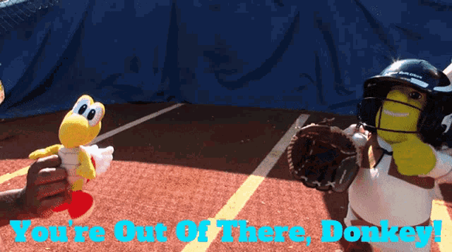 a picture of two stuffed animals on a baseball field with the words you 're out of there donkey