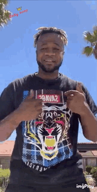 a man wearing a shirt with a tiger on it