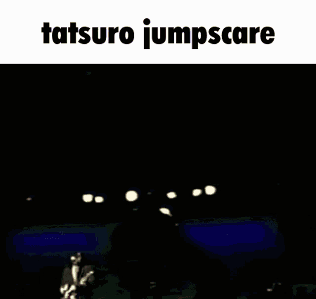 a man is singing into a microphone with the words tatsuro jumpscare above him