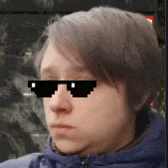 a man wearing a blue jacket and sunglasses with pixel art on his face