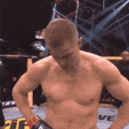 a shirtless man in a boxing ring with a sign that says ve