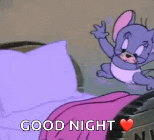 a cartoon mouse is flying over a bed with the words `` good night '' written on it .