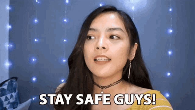 a woman says " stay safe guys " while wearing a choker