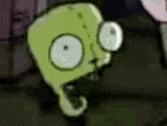 a close up of a cartoon character 's face with big eyes and a hook in its mouth .