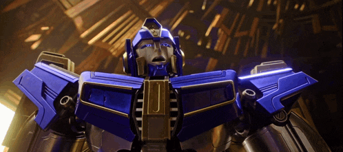 a close up of a blue and gold robot with the letter j on it