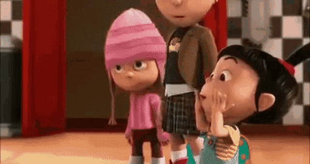 a group of three cartoon characters are standing next to each other in a room .