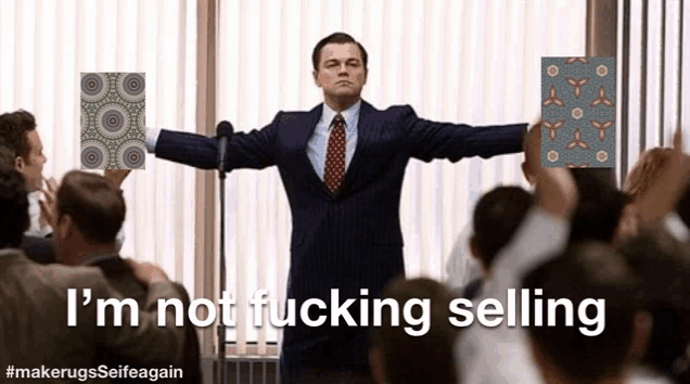 a man in a suit and tie stands in front of a crowd and says " i 'm not fucking selling " .