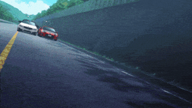 a white bmw and a red sports car are racing down a road