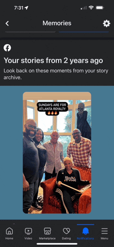 a phone screen shows a picture of a family and says " your stories from 2 years ago "