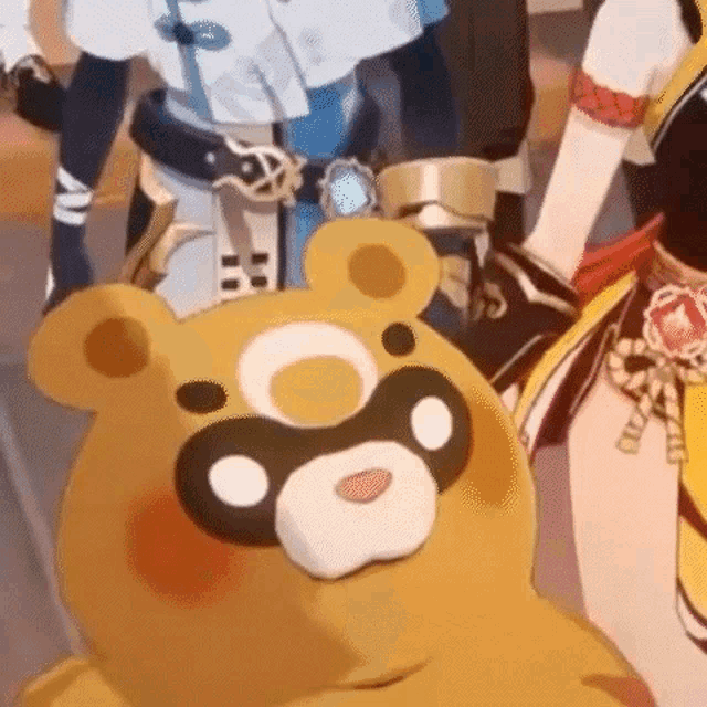 a close up of a teddy bear with a mask on its face .