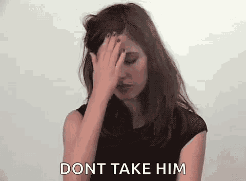 a woman is covering her face with her hand and the words `` dont take him '' are behind her .