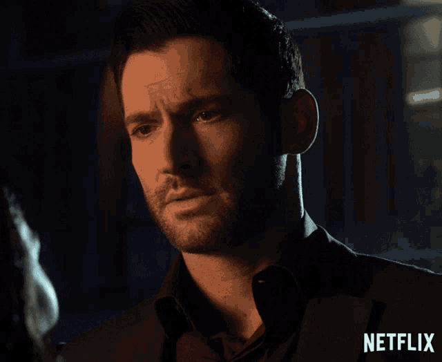 a close up of a man 's face with the word netflix on the bottom