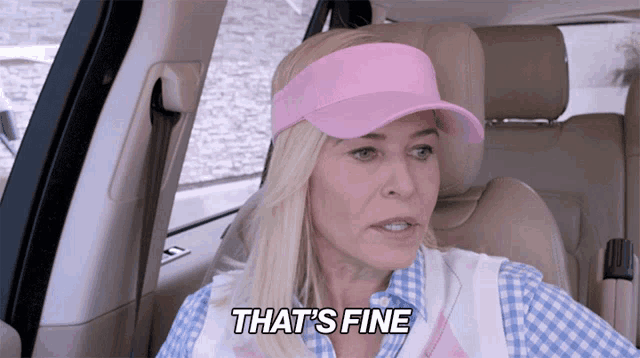 a woman wearing a pink hat and visor says " that 's fine "