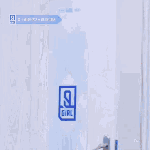 a woman wearing a white nike air shirt stands in a doorway