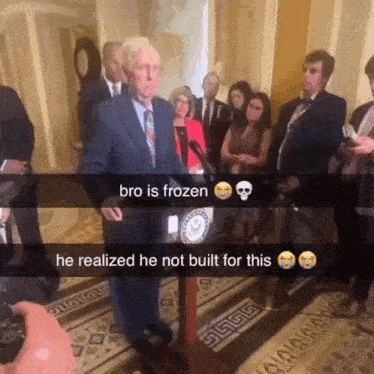 a man stands at a podium with a caption that says bro is frozen