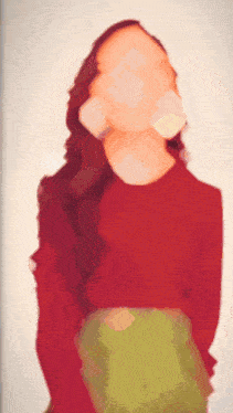 a blurred image of a woman in a red sweater