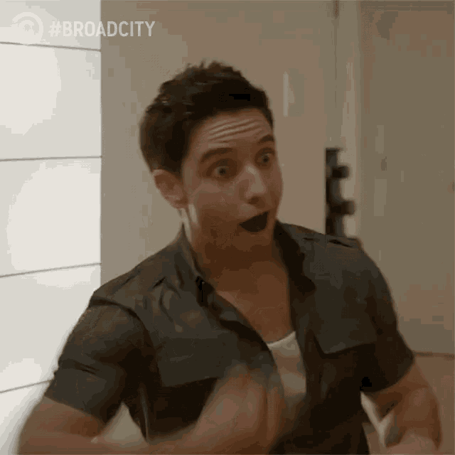a man with a surprised look on his face is featured in a broad city advertisement