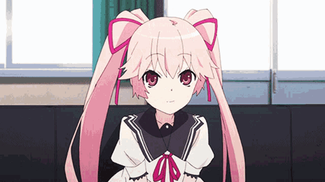 a little girl with pink hair and red eyes is sitting on a couch