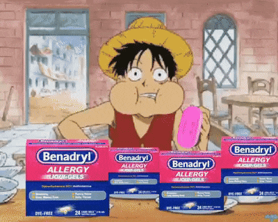 benadryl allergy liquid gels are on a table with a cartoon character