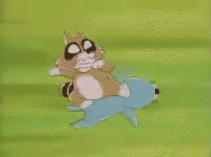 a cartoon cat is sitting on top of a blue dog on a green field .