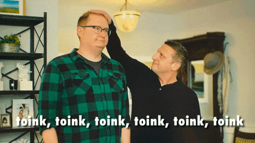 two men standing next to each other with the words toink written on the bottom