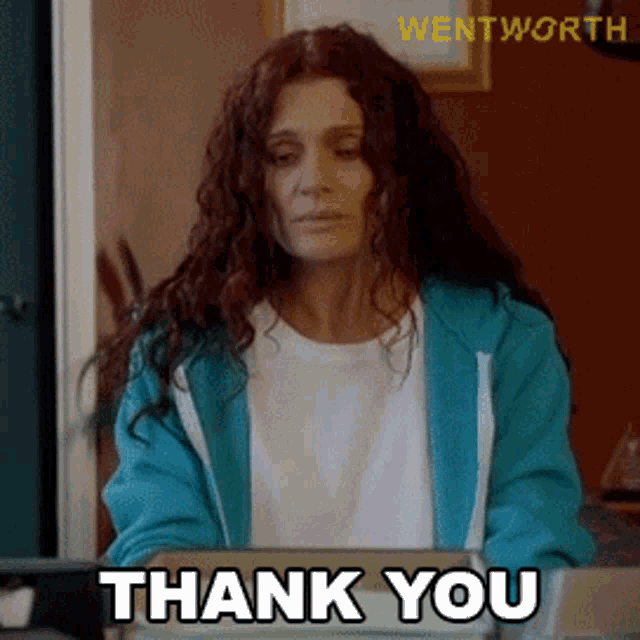 a woman with red hair says thank you