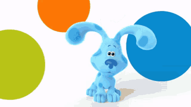 a blue dog sitting in front of three circles