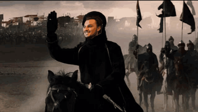 a man is riding a horse in front of a crowd of soldiers