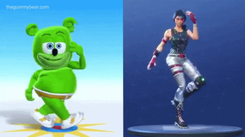 a gummy bear is dancing next to a figure of a soldier