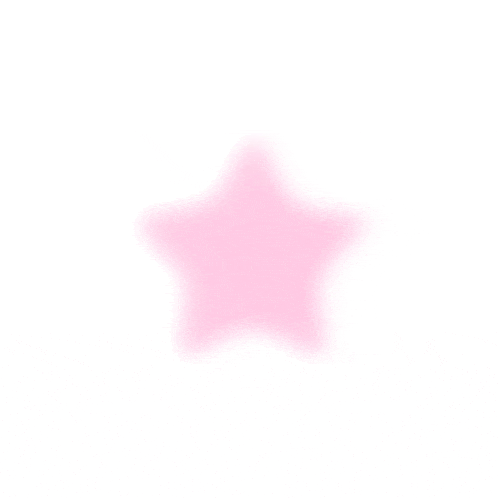 a pink star on a white background with a blurred background .