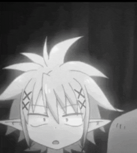 a black and white photo of a cartoon character with a strange face .