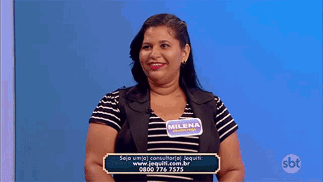 a woman wearing a name tag that says milena on it